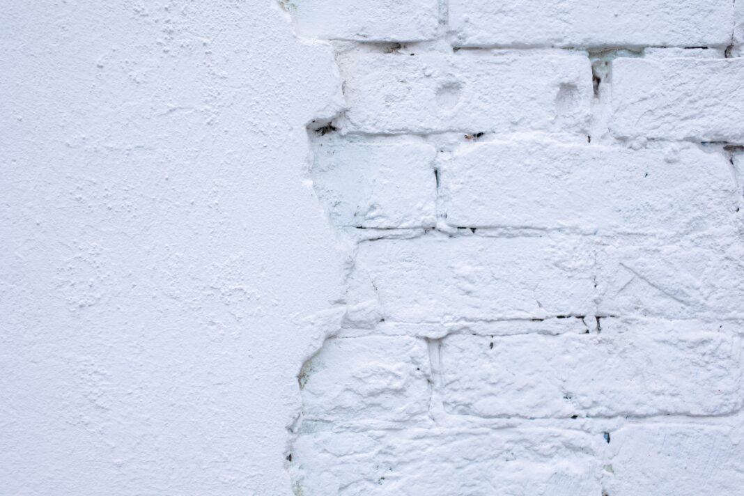 a brick wall painted white