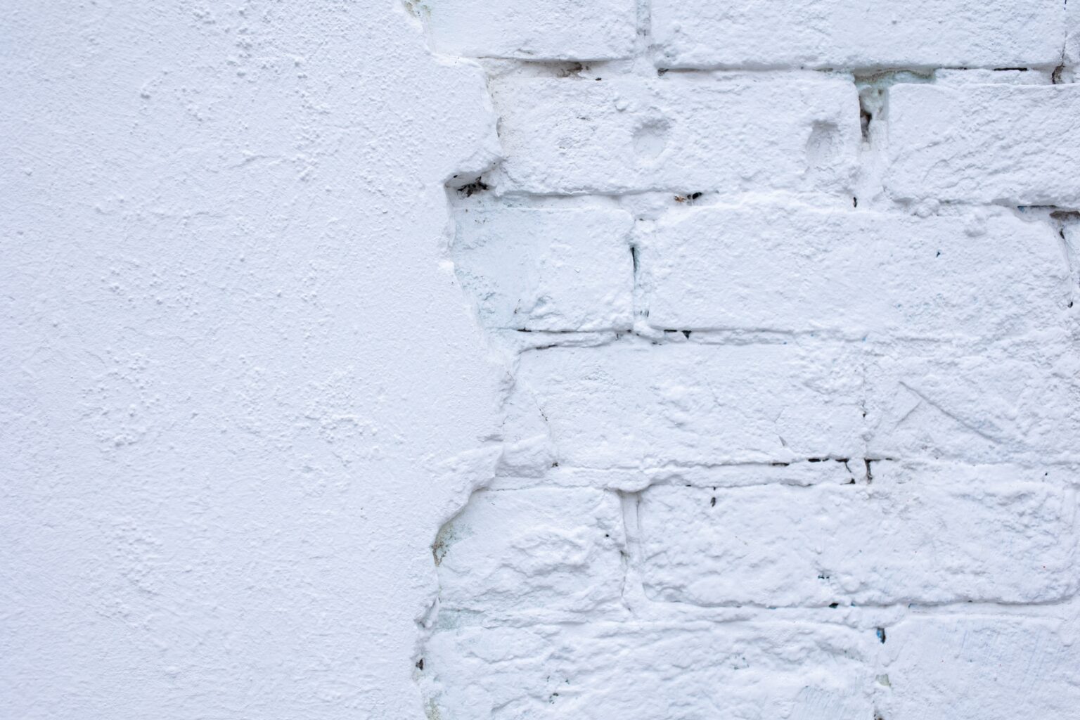 a brick wall painted white